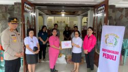 Kapolres Minahasa Salurkan Bantuan bagi Warga Terdampak Banjir di Desa Paslaten