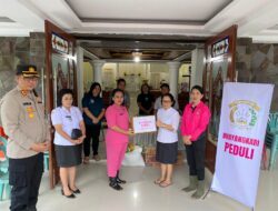 Kapolres Minahasa Salurkan Bantuan bagi Warga Terdampak Banjir di Desa Paslaten